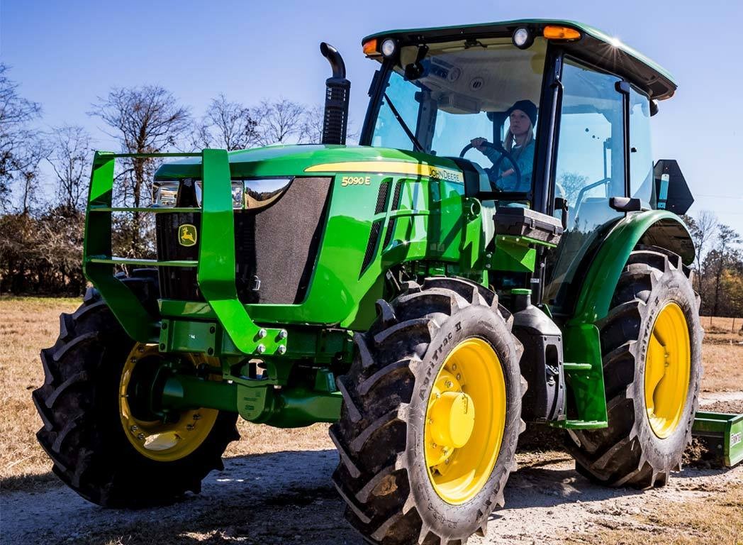 A green tractor on a farm